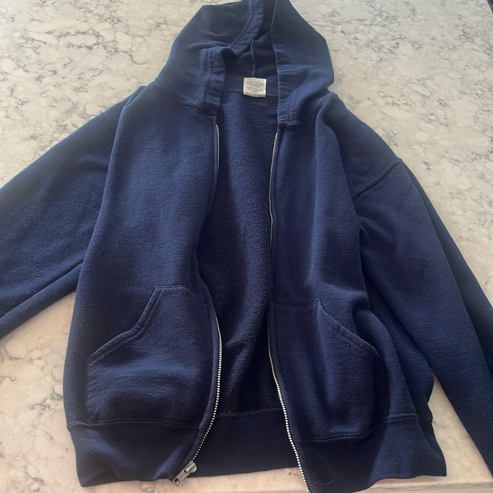 This is a navy blue hooded zip up jacket. I love it but I just don’t fit it.